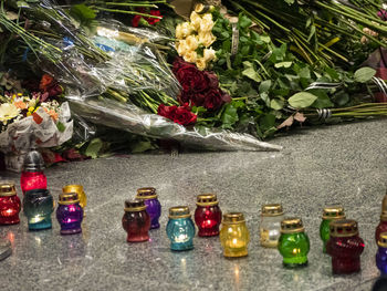 Various flowers on glass bottles