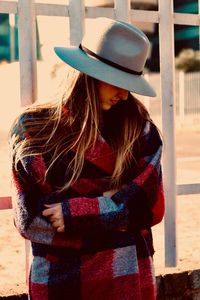 Woman wearing hat while standing outdoors