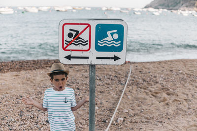 Full length of a boy standing on beach