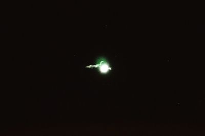 Illuminated light against sky at night