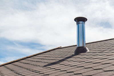 Low angle view of roof of building against sky