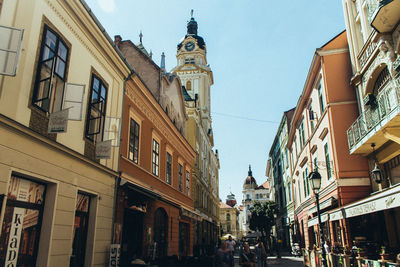 Street amidst buildings against sky in city