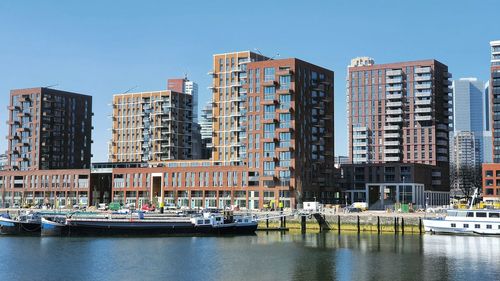 Modern buildings against clear sky in city