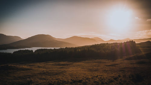 Scenic view of landscape against sky during sunset