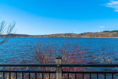 Scenic view of sea against clear blue sky