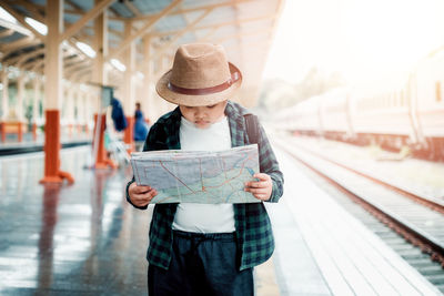Full length of a man holding a train