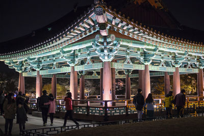 Group of people in temple outside building