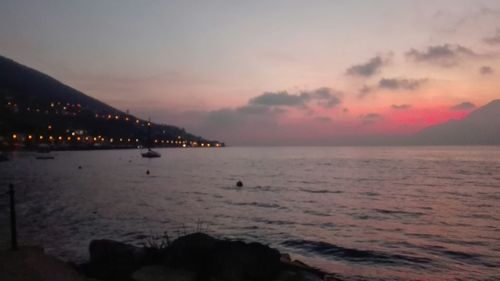 Scenic view of sea against cloudy sky