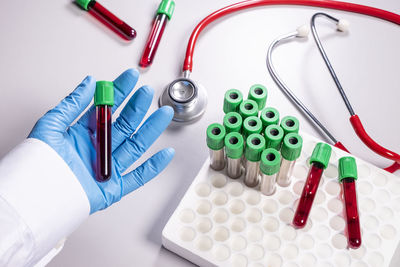 High angle view of multi colored pencils on white background