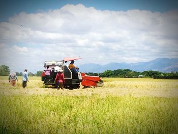Tractor on field against sky