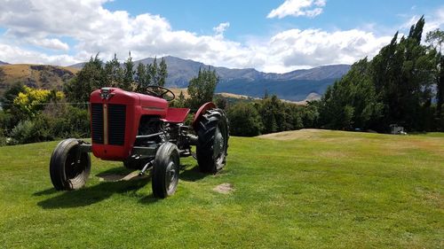 Tractor on field against sky