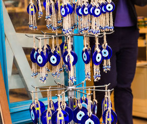 Close-up of clothes hanging in store for sale