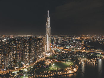 Aerial view of illuminated city buildings at night