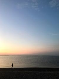 Scenic view of sea against clear sky during sunset