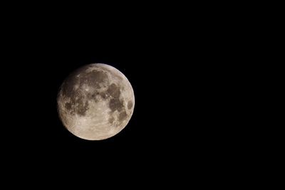 Low angle view of moon against sky at night