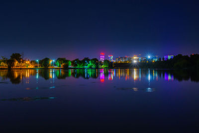 Scenic view of river against sky at night