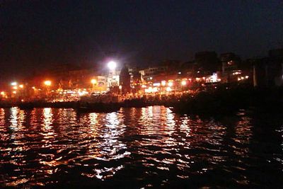 Reflection of illuminated buildings in water