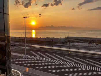 Scenic view of sea against orange sky