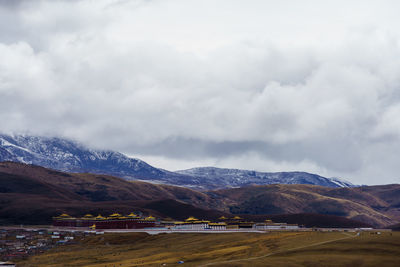 Scenic view of mountains and tibetan temple