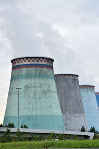 Low angle view of factory against sky