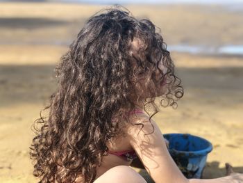 Midsection of woman at beach