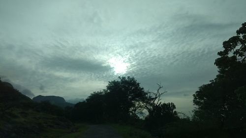 Scenic view of landscape against cloudy sky