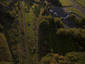 High angle view of trees and houses on field