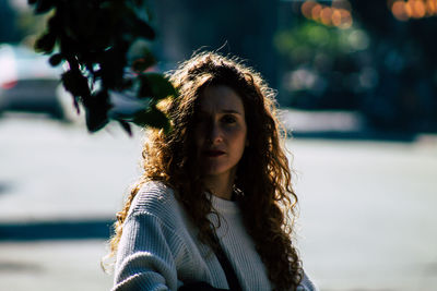 Portrait of young woman outdoors