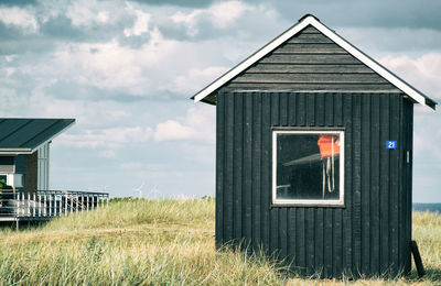 House on field against sky