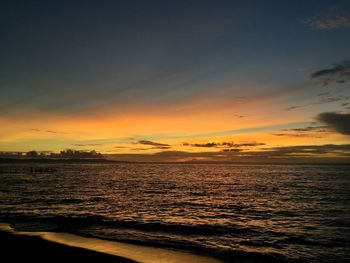 Scenic view of sea at sunset