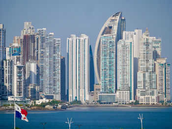 Modern buildings in city against sky