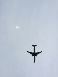 Low angle view of airplane in sky