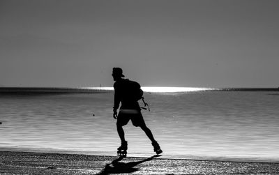 Woman standing on beach