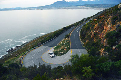 High angle view of car on road by sea
