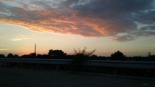 Scenic view of landscape against sky at sunset