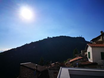 Houses in town against clear sky