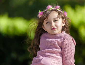 Portrait of cute girl standing outdoors