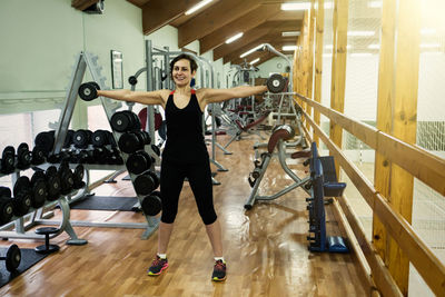 Full length portrait of woman smiling