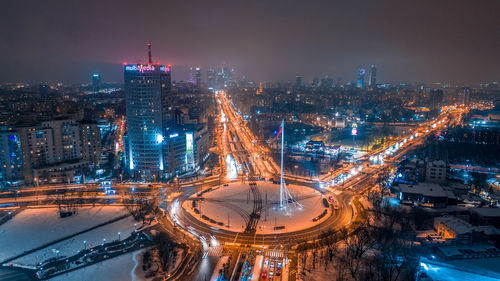 Aerial view of illuminated city at night