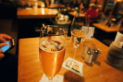 Close-up of beer glass on table