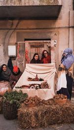 Group of people at market stall