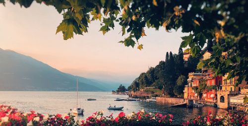 Scenic view of sea and mountains against sky