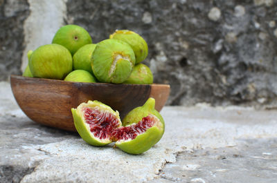 Wooden bowl with fresh, sweet figs in summer