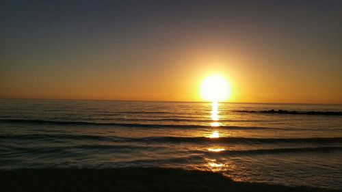 Scenic view of sea at sunset