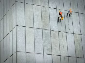 High angle view of men working on floor