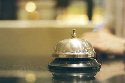 Close-up of service bell on table
