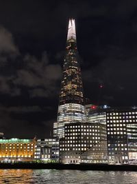 Illuminated buildings in city at night