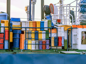 Close-up of multi colored metallic structure against buildings