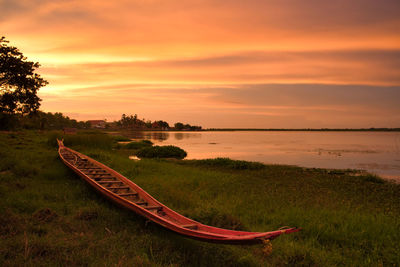 Scenic view of lake against sky during sunset