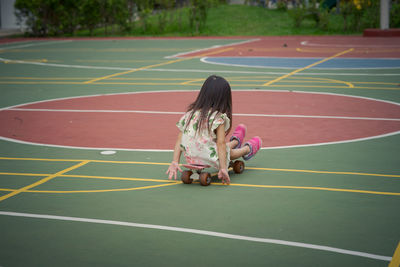 Girl playing with umbrella